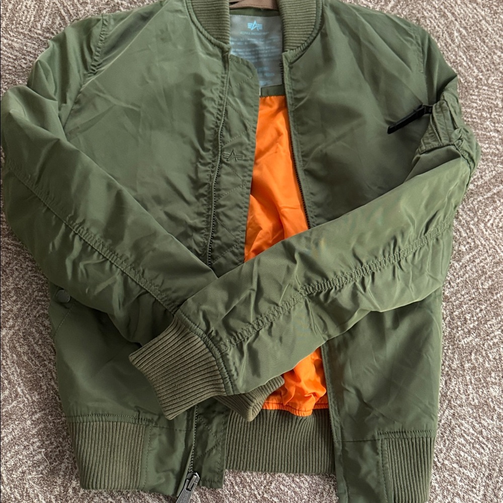 Alpha Industries Olive Bomber Jacket with Orange Lining.